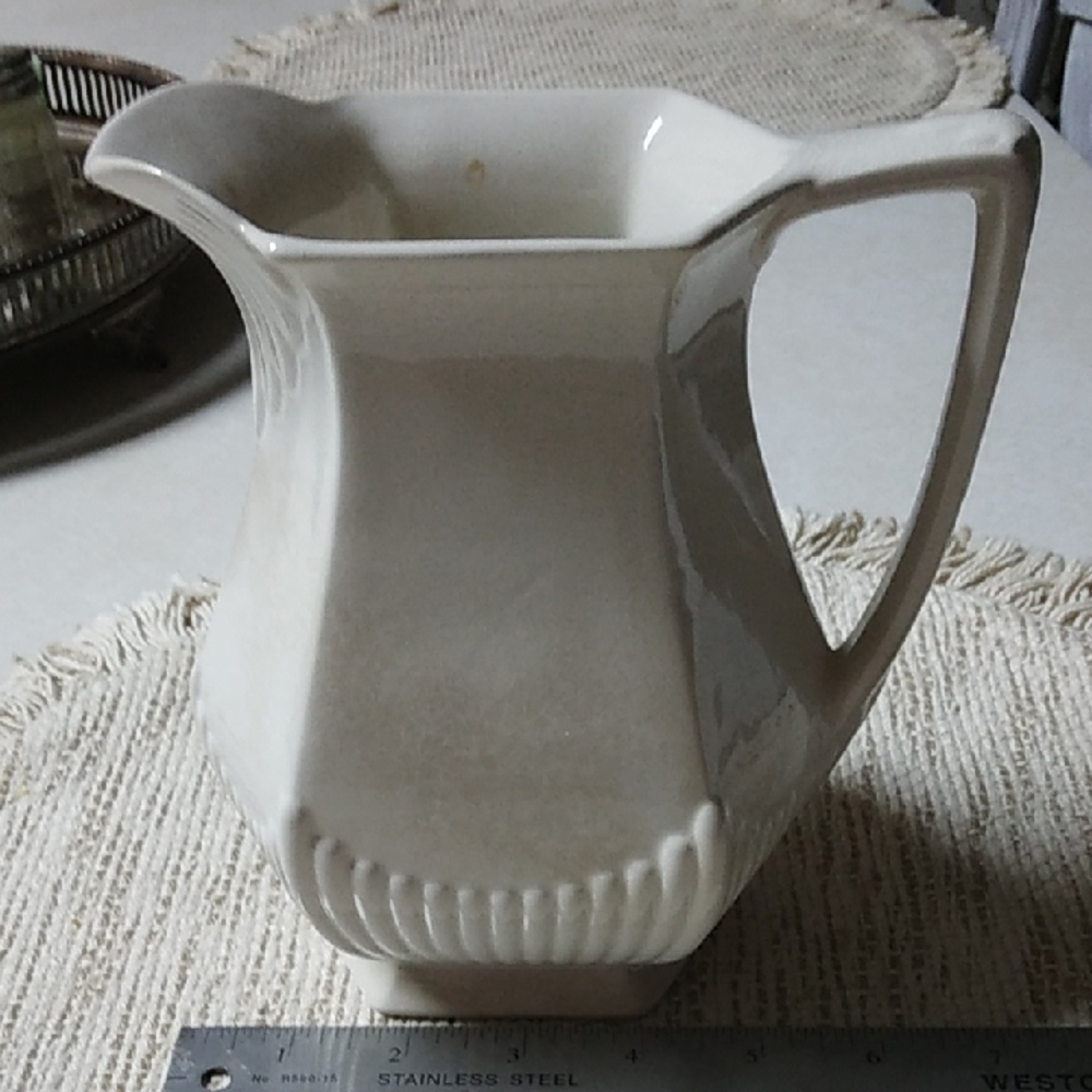 Elegant Cream Ceramic Art Piece with Fluted Design